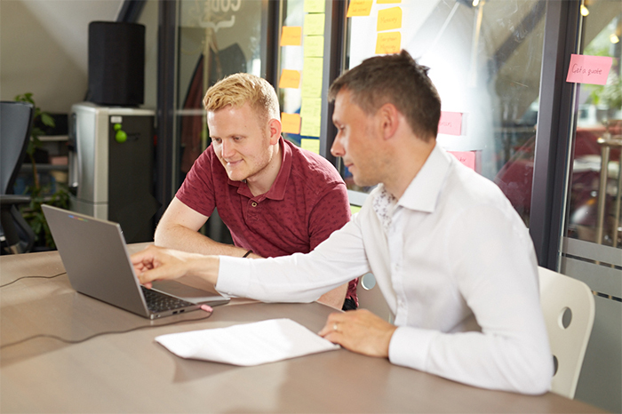 People looking through content and discussing ideas